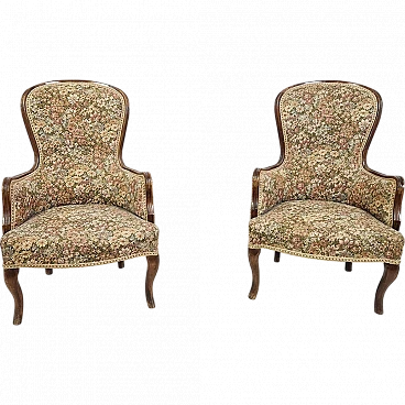 Wooden armchair covered with floral fabric