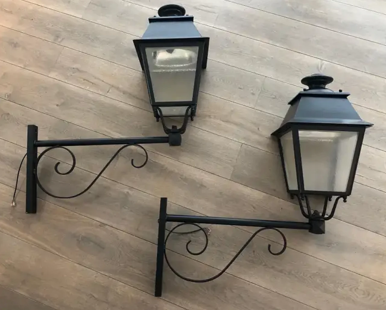 Pair of iron outdoor lanterns on shelves, 1950s 2