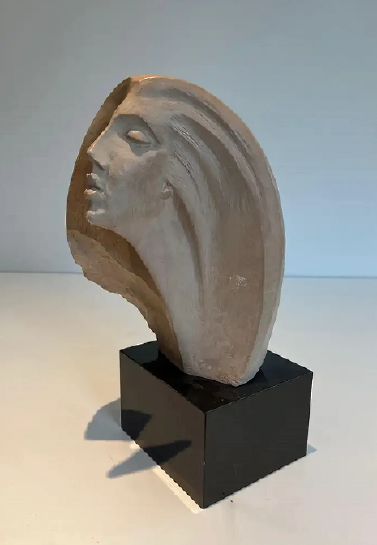 Terracotta sculpture representing a coman's face, 1980s 2