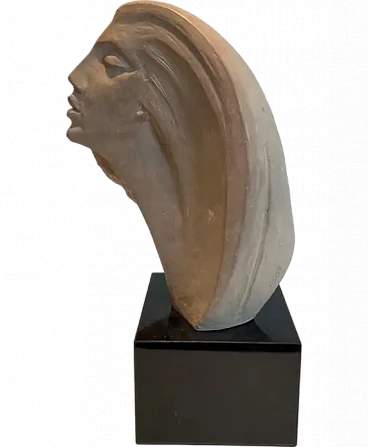 Terracotta sculpture representing a coman's face, 1980s