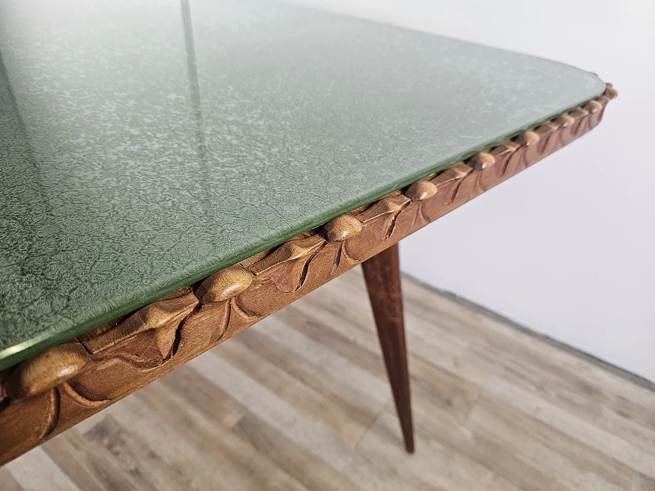 Table in carved wood with decorated green glass top, 60s 10