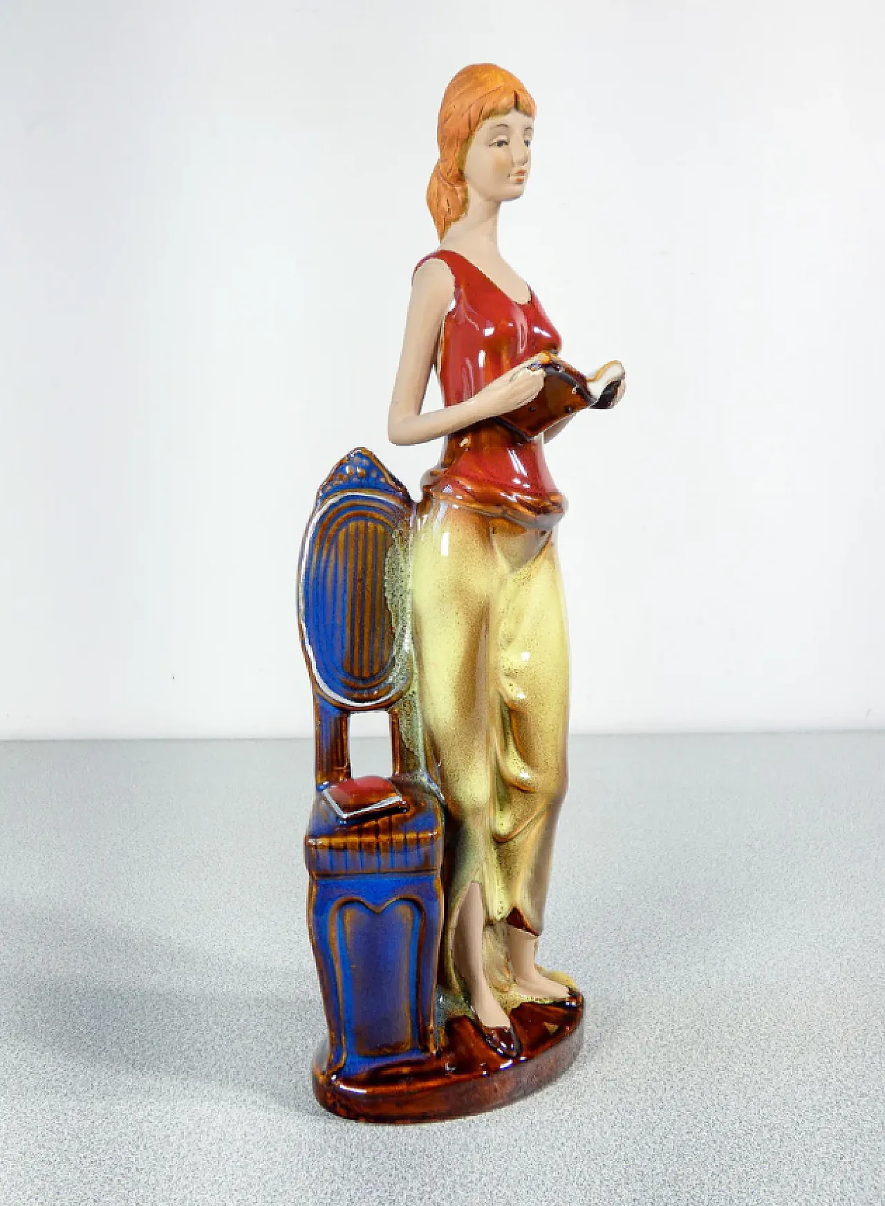 Woman with books in painted and glazed ceramic, mid-20th century 1