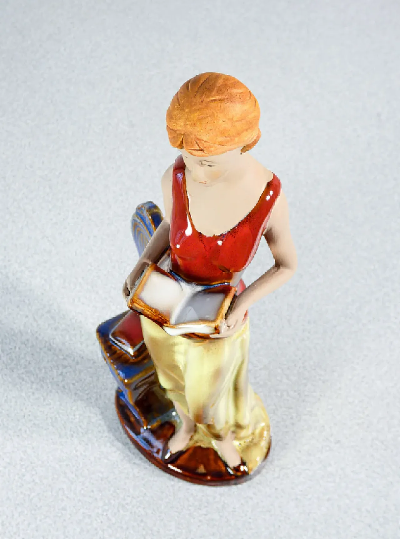 Woman with books in painted and glazed ceramic, mid-20th century 4