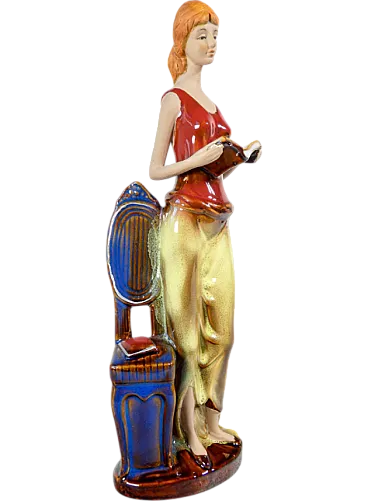 Woman with books in painted and glazed ceramic, mid-20th century