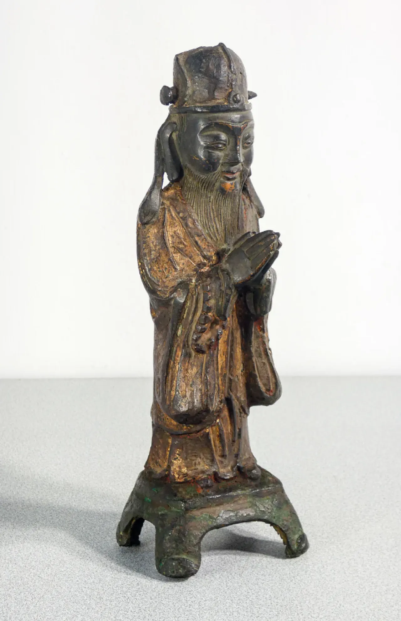 Bronze sculpture of dignitary with clasped hands, 17th century 1