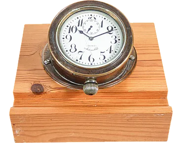 Brass clock with wooden base by Doxa, 1940s