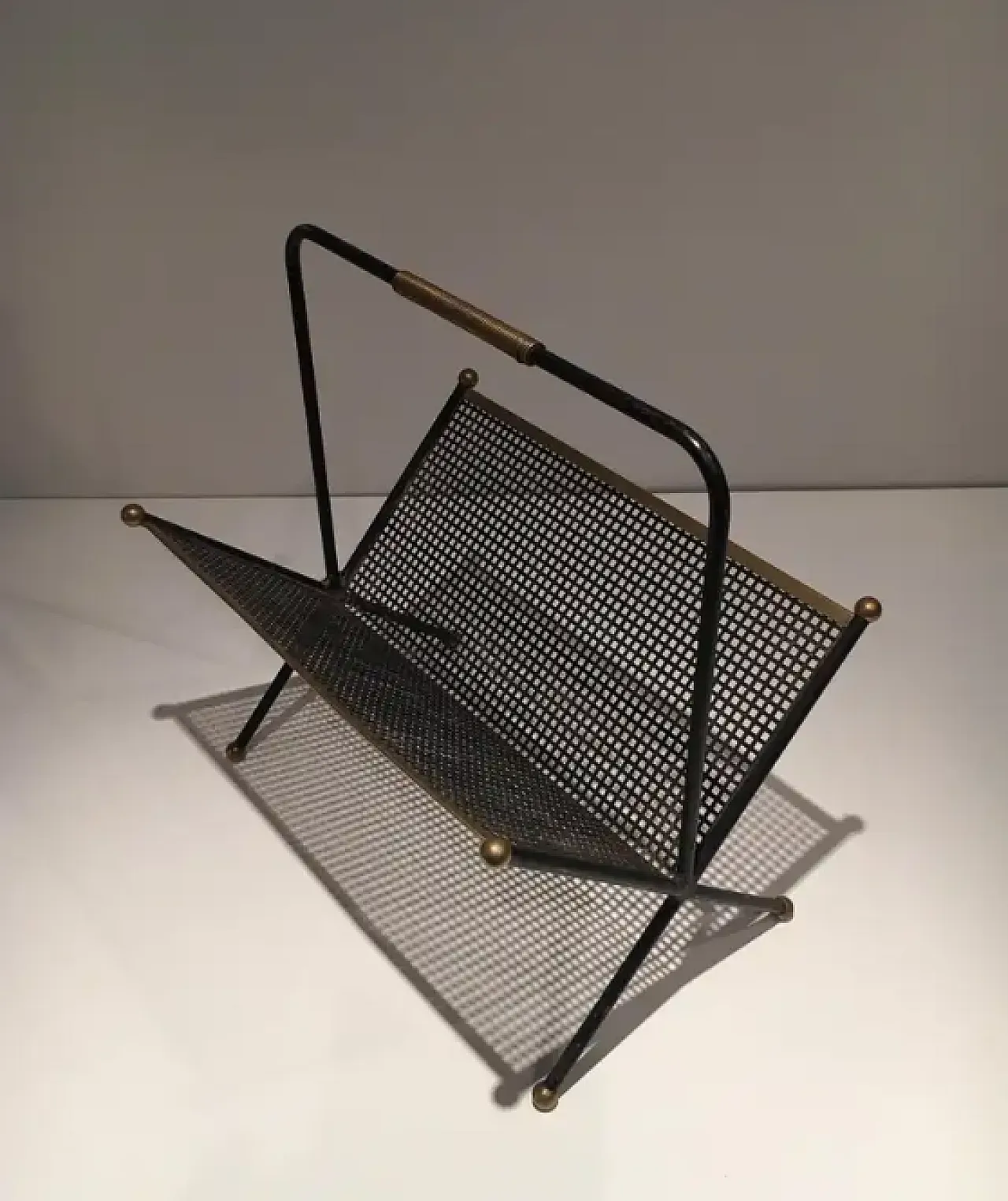 Magazine rack in lacquered perforated sheet metal and brass, 1950s 3