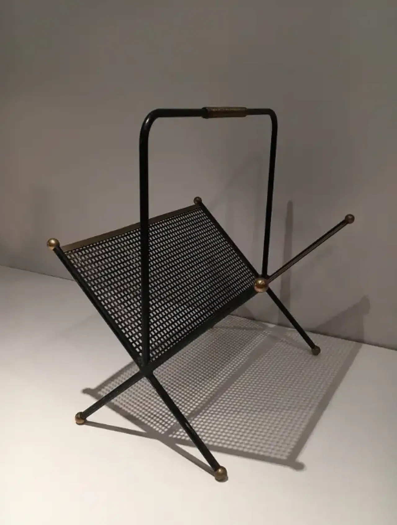 Magazine rack in lacquered perforated sheet metal and brass, 1950s 5