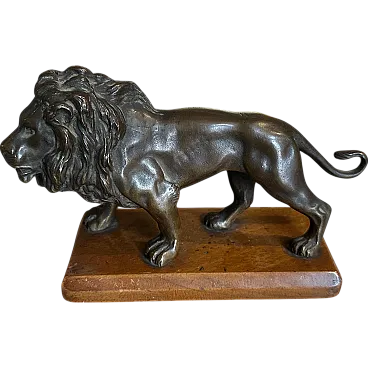 Neoclassical bronze lion on wooden base, 19th century