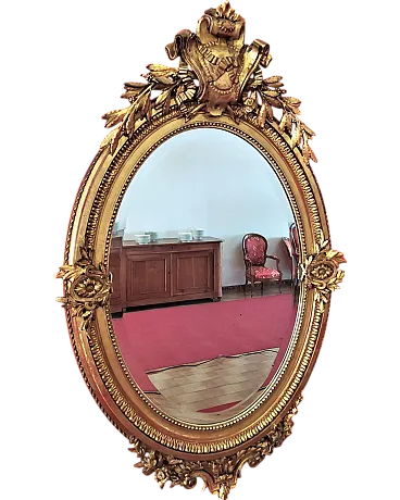 Oval mirror in gilded plaster, 19th century