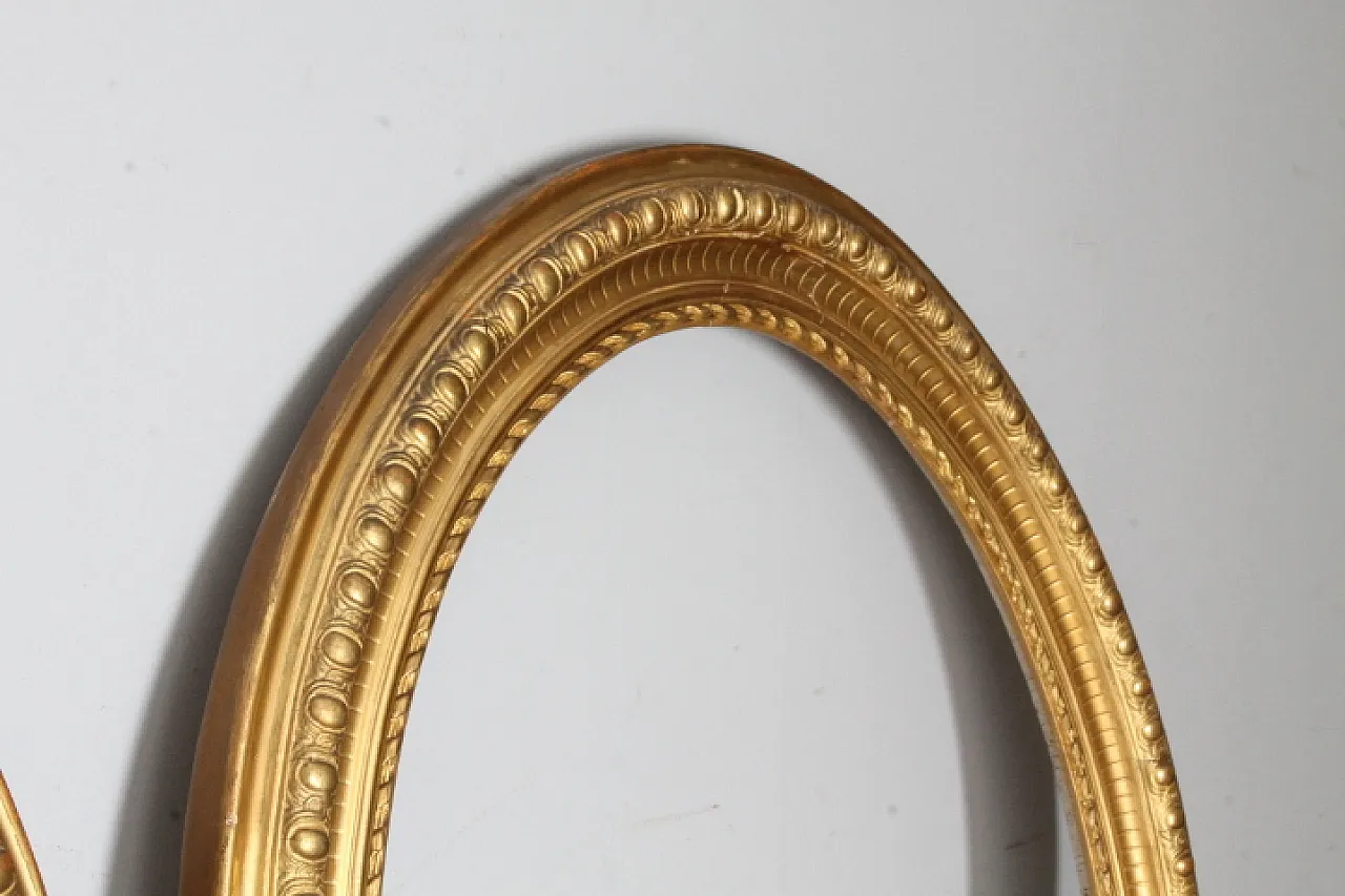 Pair of gold-leaf gilded oval beveled frames, 19th century 2