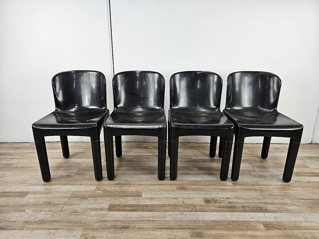 4 modern chairs in black plastic, 1970 1