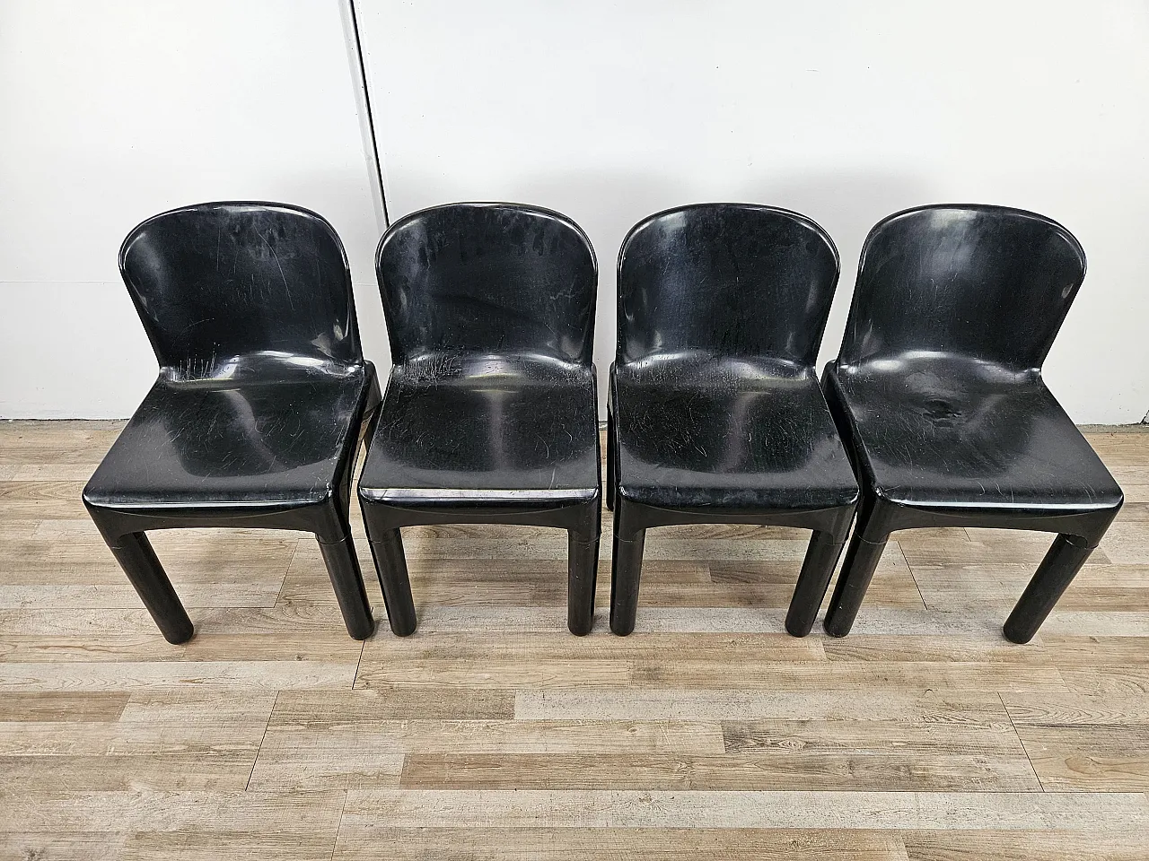 4 modern chairs in black plastic, 1970 2