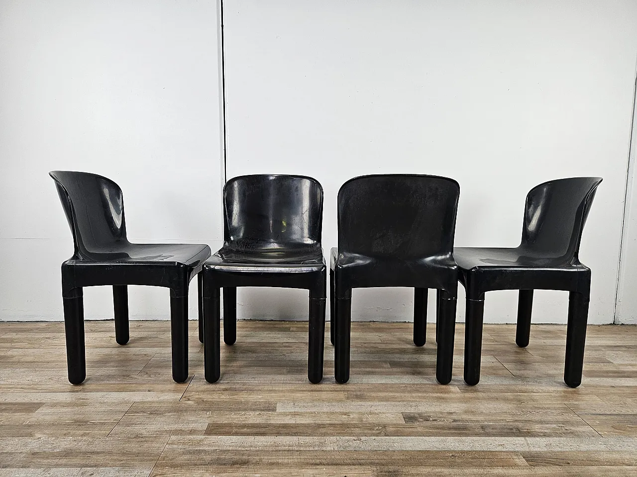 4 modern chairs in black plastic, 1970 3