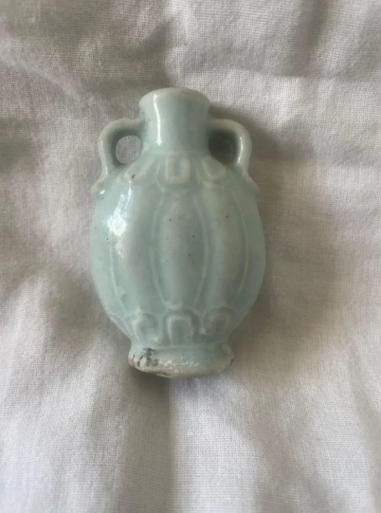 Light green Chinese bottle with relief panels, 19th century 2