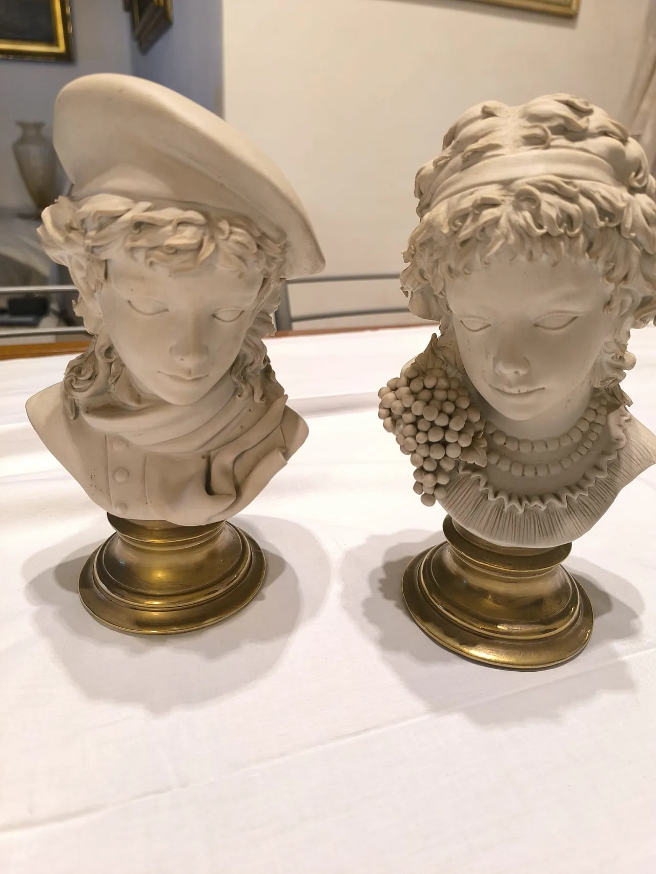 Pair of Capitelli in biscuit, early 20th century 1