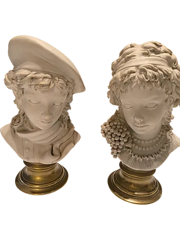 Pair of Capitelli in biscuit, early 20th century