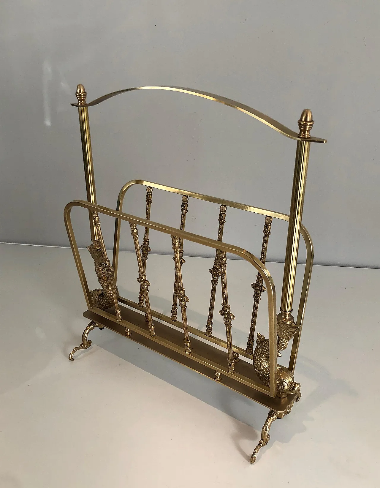 Brass magazine rack with dolphin heads by Maison Jansen, 1940s 12