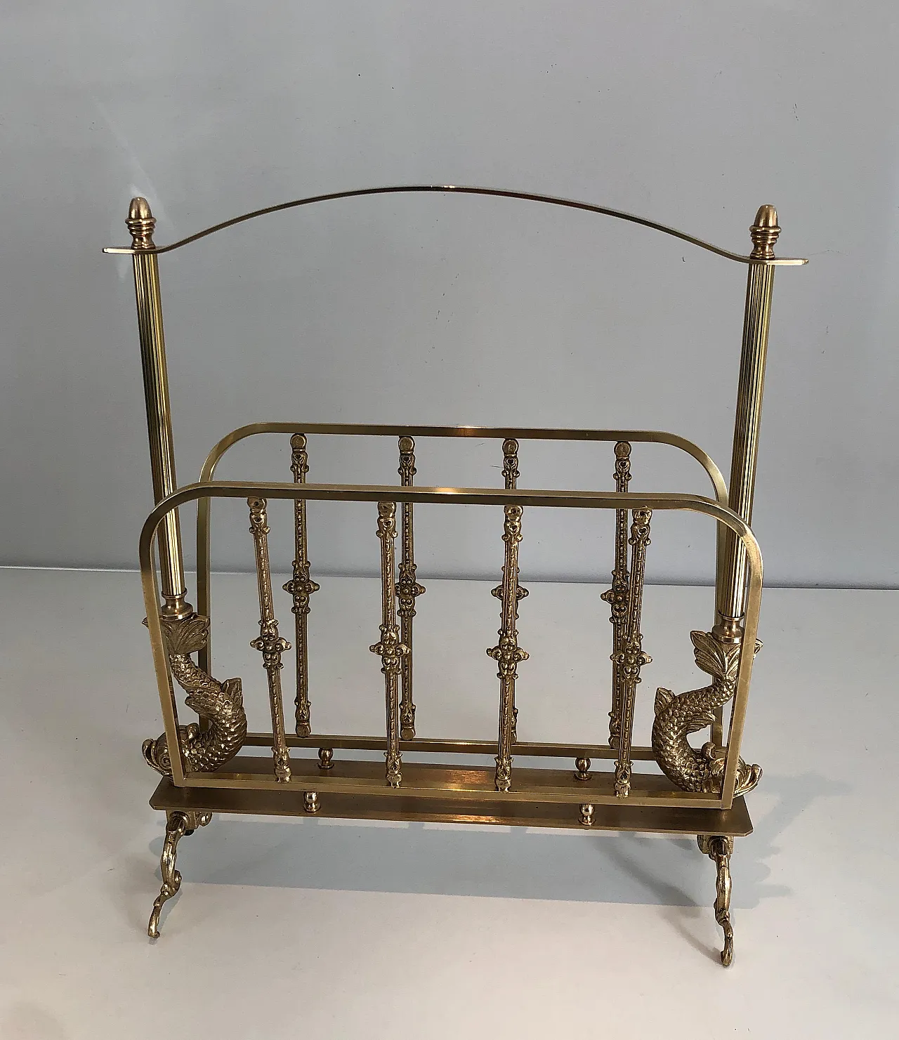 Brass magazine rack with dolphin heads by Maison Jansen, 1940s 13