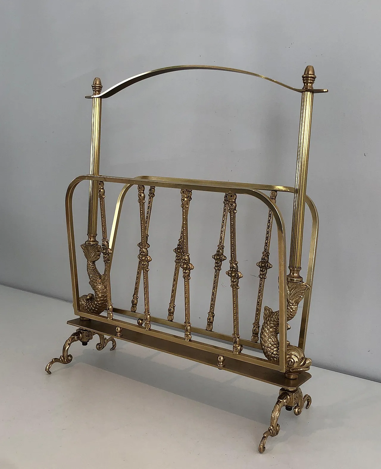 Brass magazine rack with dolphin heads by Maison Jansen, 1940s 15