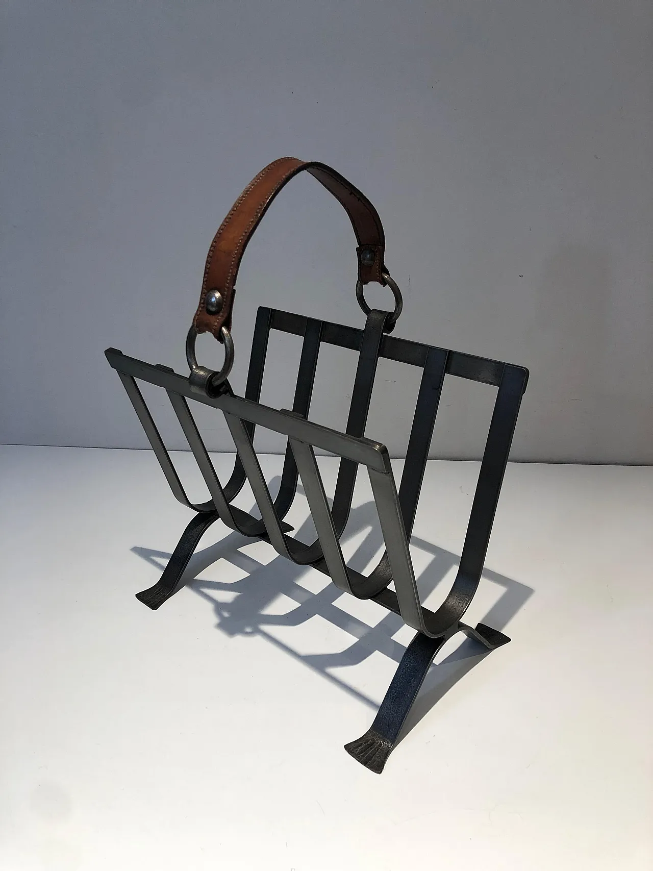 Steel and leather magazine rack, 1950s 12