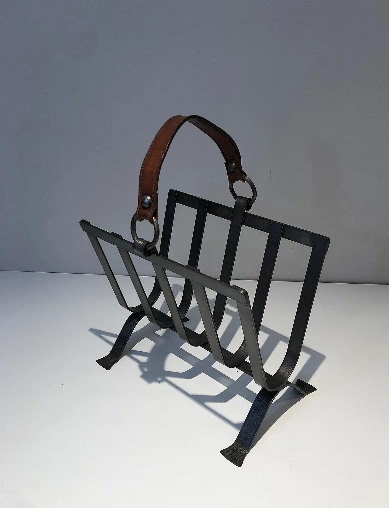 Steel and leather magazine rack, 1950s 13