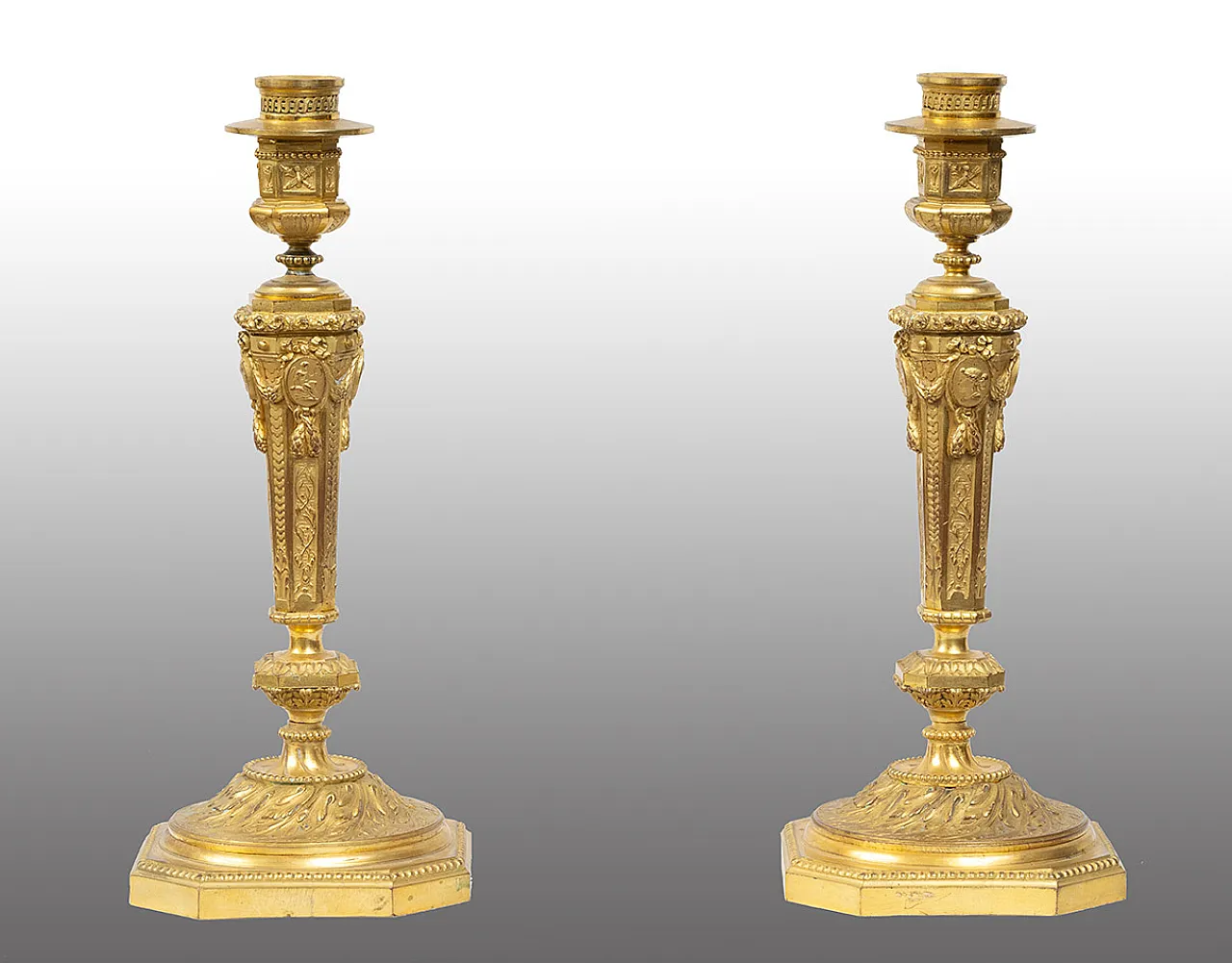 Pair of ancient golden bronze candlesticks, France, 19th century. 1