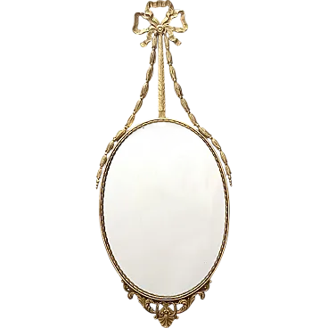 Oval wall mirror with brass frame and ribbon, 70s